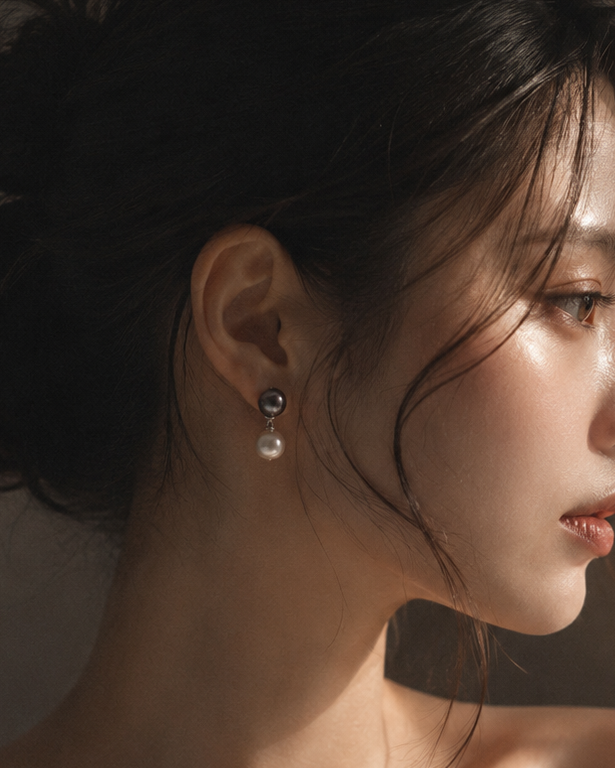 Close-up of a woman wearing earrings with a soft focus background